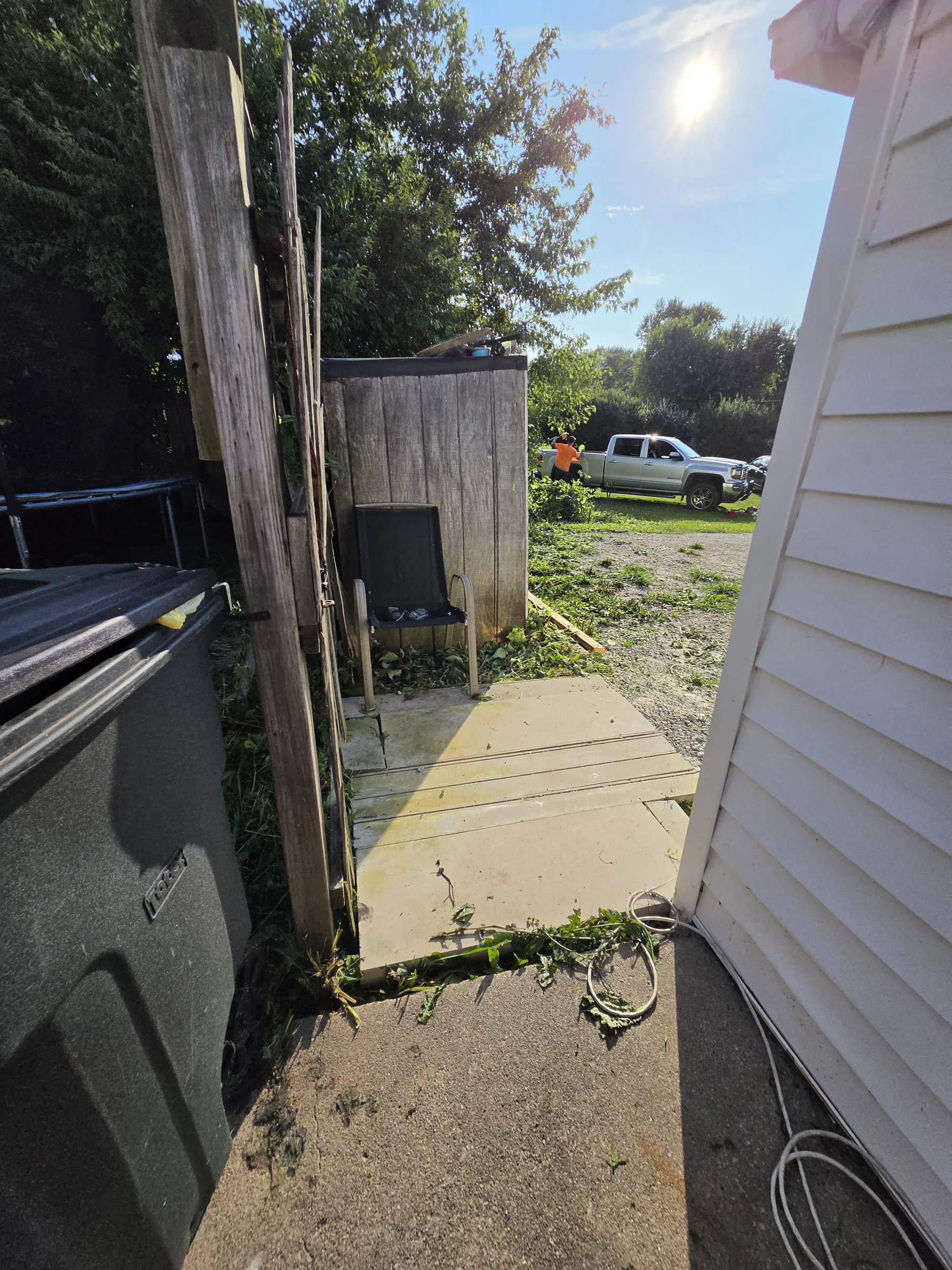 Walkway and side-access area after overgrown vegetation was cleared